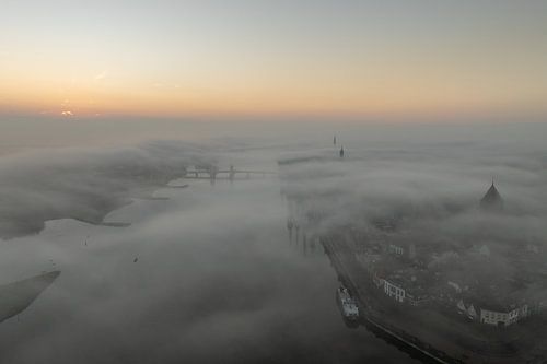 The city front of Kampen in the mist by Evert Jan Kip