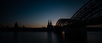 The Hohenzollern Bridge with the DOM by night by Hans Kool