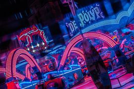 Arches of light – a carousel spinning at the night-time fair by Mixed media vector arts