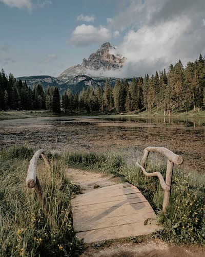 Mountain lake with wooden bridge in South Tyrol