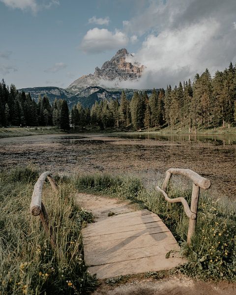 Mountain lake with wooden bridge in South Tyrol by Fabiroams