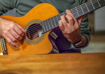 Man plays acoustic guitar