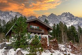 Mountain hut in the mountains on the Zugspitze in the Alps with sunset by Animaflora PicsStock