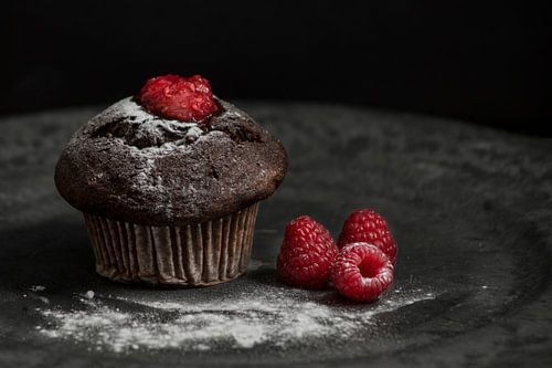 chocolate cupcake with raspberries
