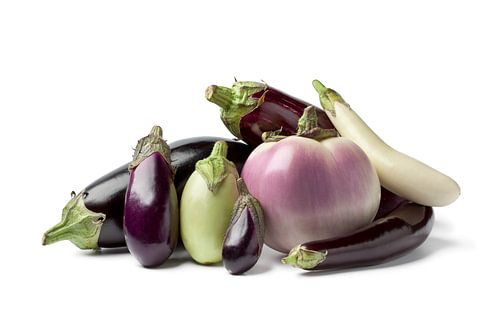 Composition of different shapes and colours of aubergines