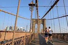 Brooklyn Bridge in New York in the morning with runners by Merijn van der Vliet