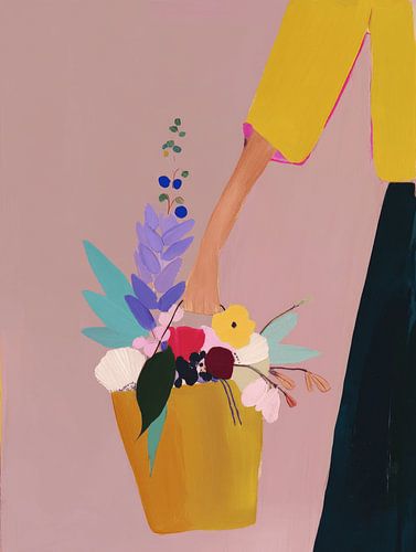 Een emmer vol met kleurrijke bloemen