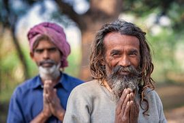 India, Men greeting and smiling. Namaste. by Frans Lemmens