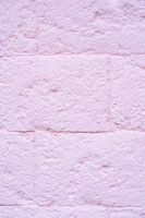 Roze stenen muur met textuur