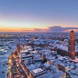 Zwolle during a cold winter sunrise with snow on the roofs