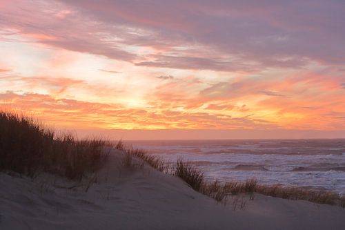 Sunset during storm at sea at Bergen aan Zee