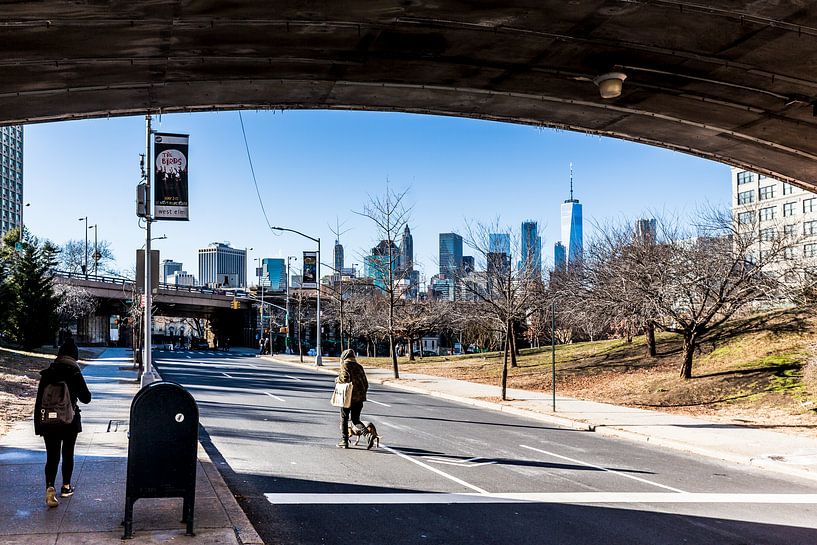 view of manhattan from under the bridge by Eric van Nieuwland