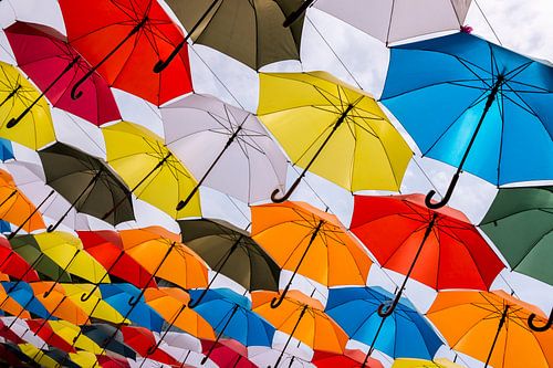 Shopping under colourful umbrellas.