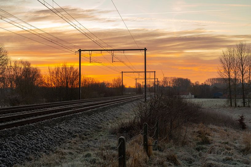 Morning sun landscape of a train track by Marcel Derweduwen