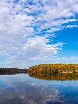 View over the lake Schmaler Luzin to the autumn field mountains