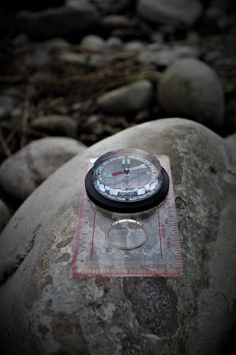 A compass on a stone