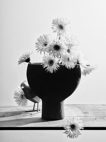 Vase with gerbera's and funny bird