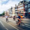 Radfahrer in Bewegung durch Amsterdam von But First Framing