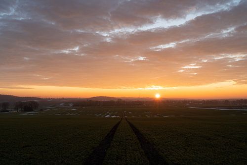 A golden sunset over wide fields