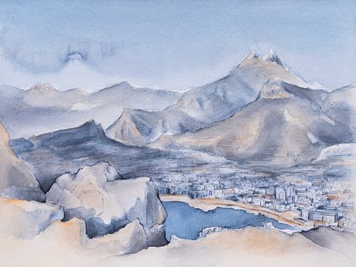 Coastal town surrounded by mountains