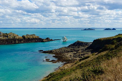 Spectacular view of green sea and sailboat Pointe Grouin