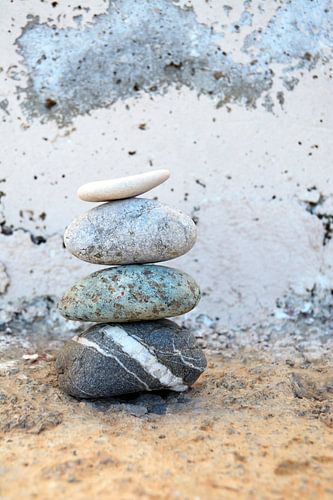 Zen pile of stones with an old background