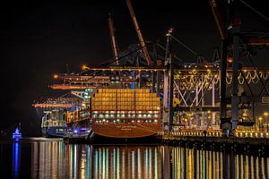 Container ship at night by Alexander Schulz