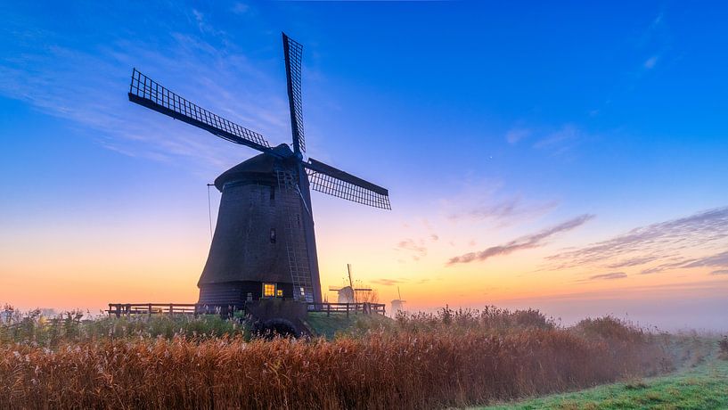 Farbenfroher Sonnenaufgang an den Schermer-Windmühlen von Photo Henk van Dijk