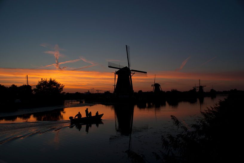 Windmills in Holland (Kinderdijk) against de sunset by Birgitte Bergman