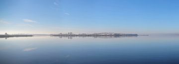 Frozen island in a calm winter lake landscape by Sjoerd van der Wal Photography