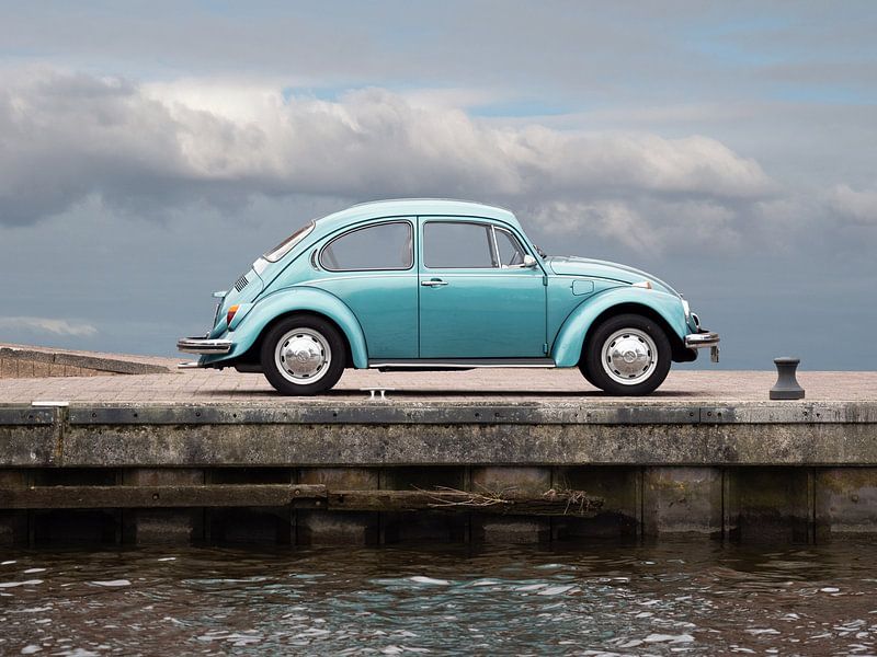 Volkswagen beetle on quay by Robin Jongerden