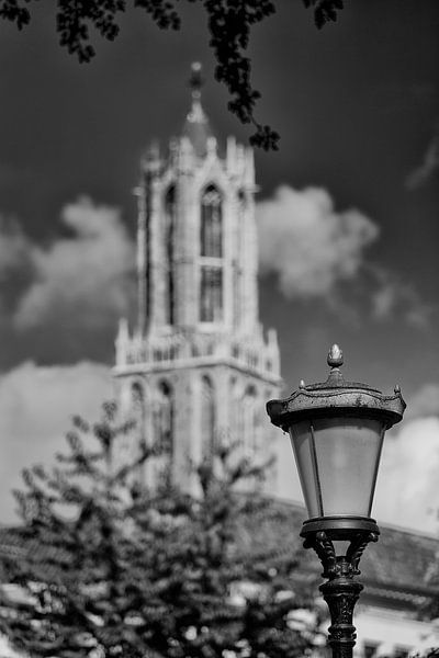 A blurred Dom tower in Utrecht as seen from Nieuwegracht in black and white by André Blom Fotografie Utrecht