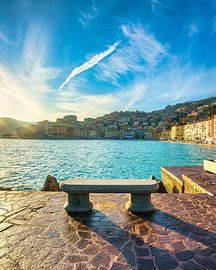 Bench on the seafront in Porto Santo Stefano, Italy by Stefano Orazzini