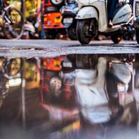 Scooters in puddle, Old Delhi, India by Leonie Broekstra