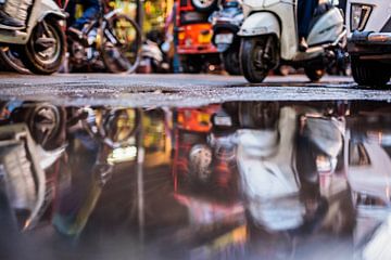 Scooters in puddle, Old Delhi, India by Leonie Broekstra