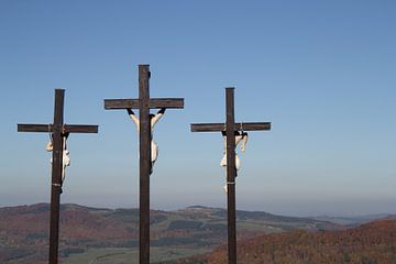 3 crosses on the Kreuzberg in the Rhön with autumn forest