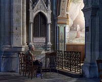 An almost serene photo of a praying lady