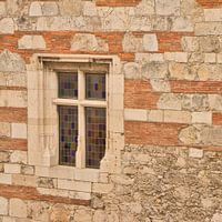 Stained glass window in beautiful stone building