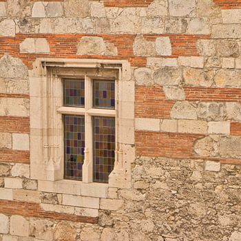 Stained glass window in beautiful stone building