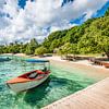 Boat at Cayo Levantado Island beach by Nancy Pauwels Photo