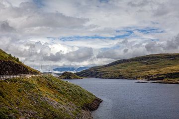 Shore road in a barren Norwegian landscape by Studio17
