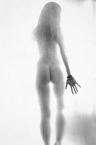 Woman taking a shower in black and white