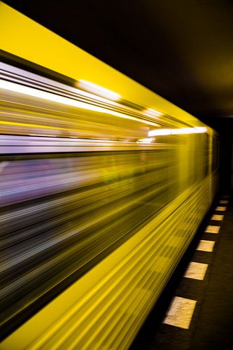 Yellow subway Berlin leaving station