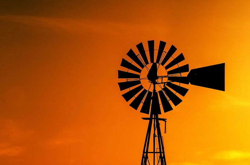 Windmill with setting sun by RICHARD Degenhart