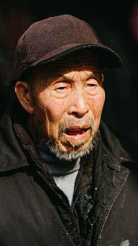 Portrait of a man wearing a hat in China