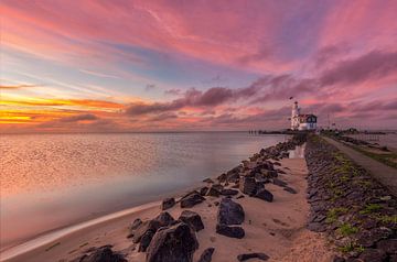 Sunrise by the lighthouse of Marken by Costas Ganasos