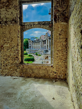 The curved building looks so impressive through a window.