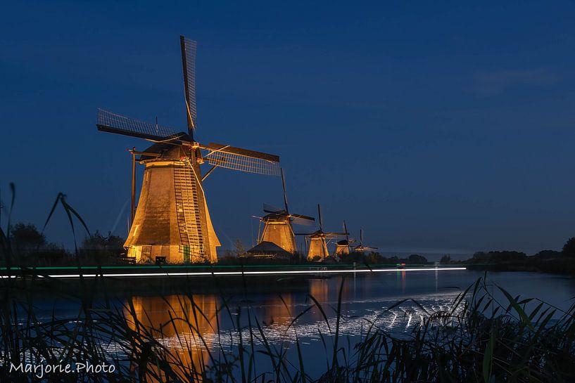 Illuminated windmills at Kinderdijk by Marjorie Ruts