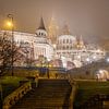 The Fishermen's Bastion and Matthias Church in the mist in the evening by Jeroen de Jongh