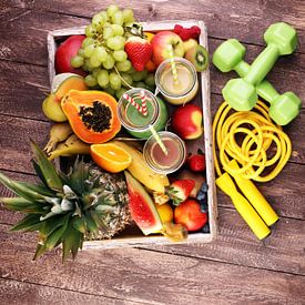 Healthy lifestyle concept with sports equipment and bottles of fruit juices by Beats